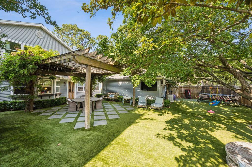 Gorgeous perspective of the backyard and putting green to the right.