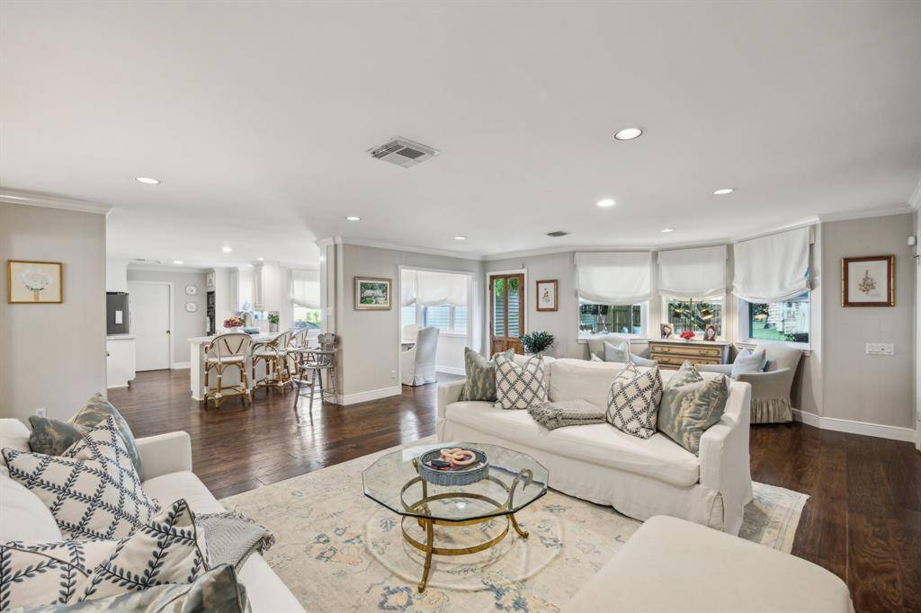 Another view of the den with view towards the bright kitchen and breakfast room.
