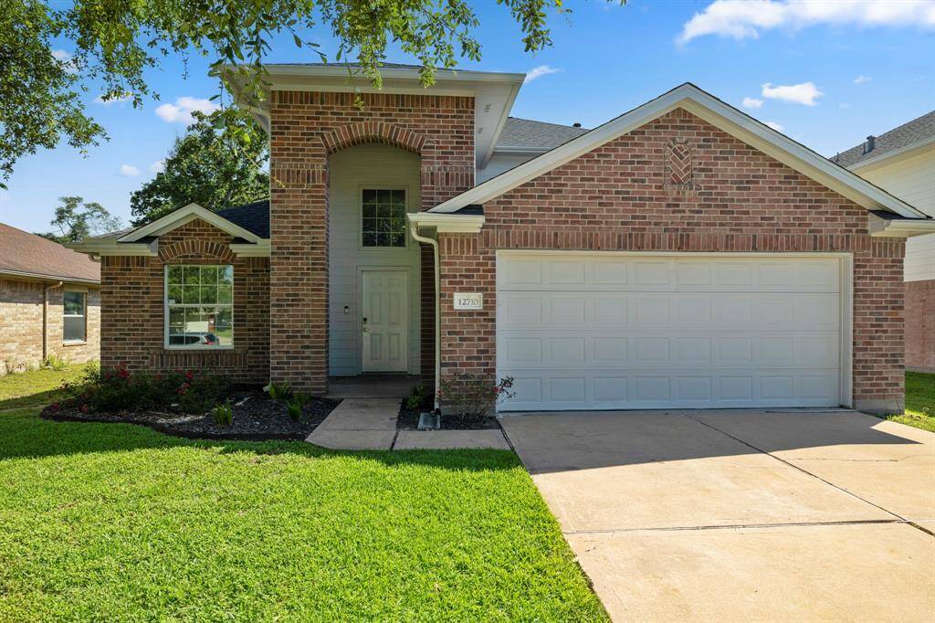 Charming Two-Story Brick Home with Great Curb AppealWelcome to 12710, a beautifully maintained two-story brick home nestled in a quiet, family-friendly neighborhood. This inviting residence features a spacious two-car garage and a long, clean driveway that offers ample parking. The classic red brick exterior, complemented by a crisp white trim and an arched entryway, creates a warm and welcoming first impression.