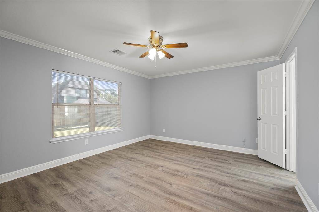Welcome to your master bedroom! Located at the back right of the home, the master bedroom boasts high ceilings centered by a HUGE ceiling fan & floor to ceiling windows w/ a view of the backyard.