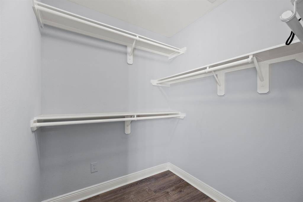 Here is an inside look at the HUGE master walk-in closet featuring wall-to-wall shelving and hanging racks throughout for all your storage needs.