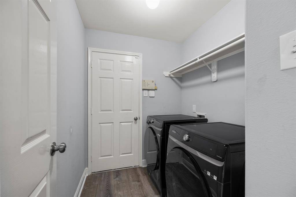 This well-appointed laundry room combines practicality with modern convenience. Featuring a high-performance LG washer and dryer set, laundry day becomes both efficient and effortless.