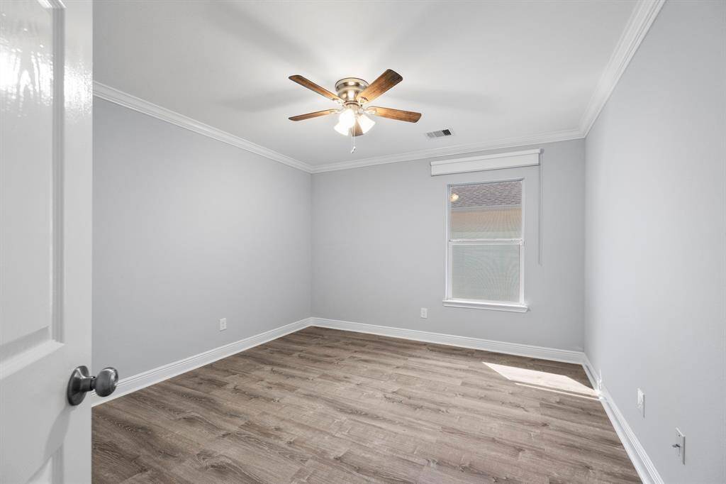 Located on the second floor, this comfortable secondary bedroom offers a quiet retreat with ample space and natural light.