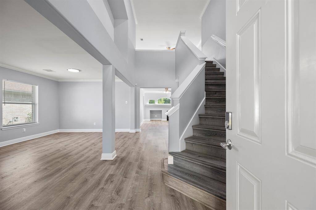 Step inside and be greeted by soaring ceilings, abundant natural light, and a sleek, contemporary design. This open-concept layout offers a seamless flow from the formal living space to the heart of the home, perfect for both relaxing and entertaining.