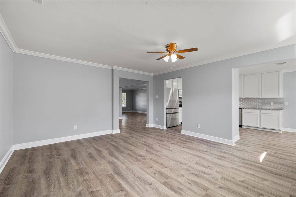 A final look into the spacious living room shows the alcove to the right that leads into the master bedroom & ensuite bathroom.