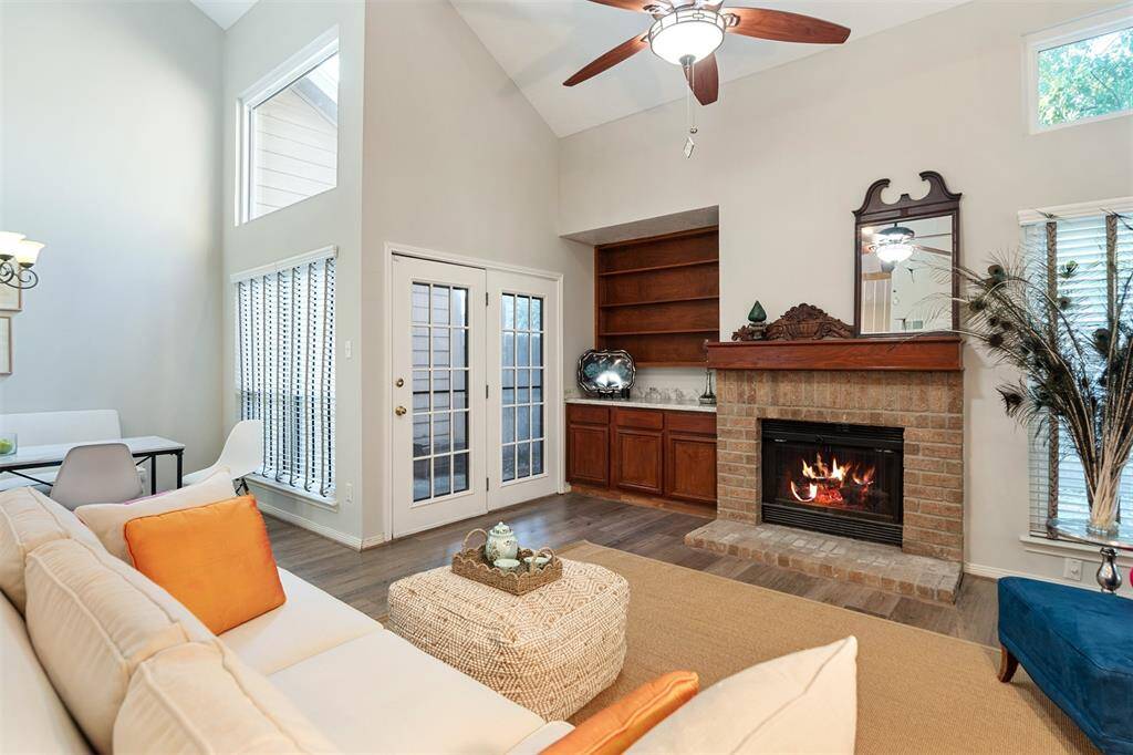 French doors provide light and access to one of the 2 back patios.  There is plenty of room for an outdoor grilling area.