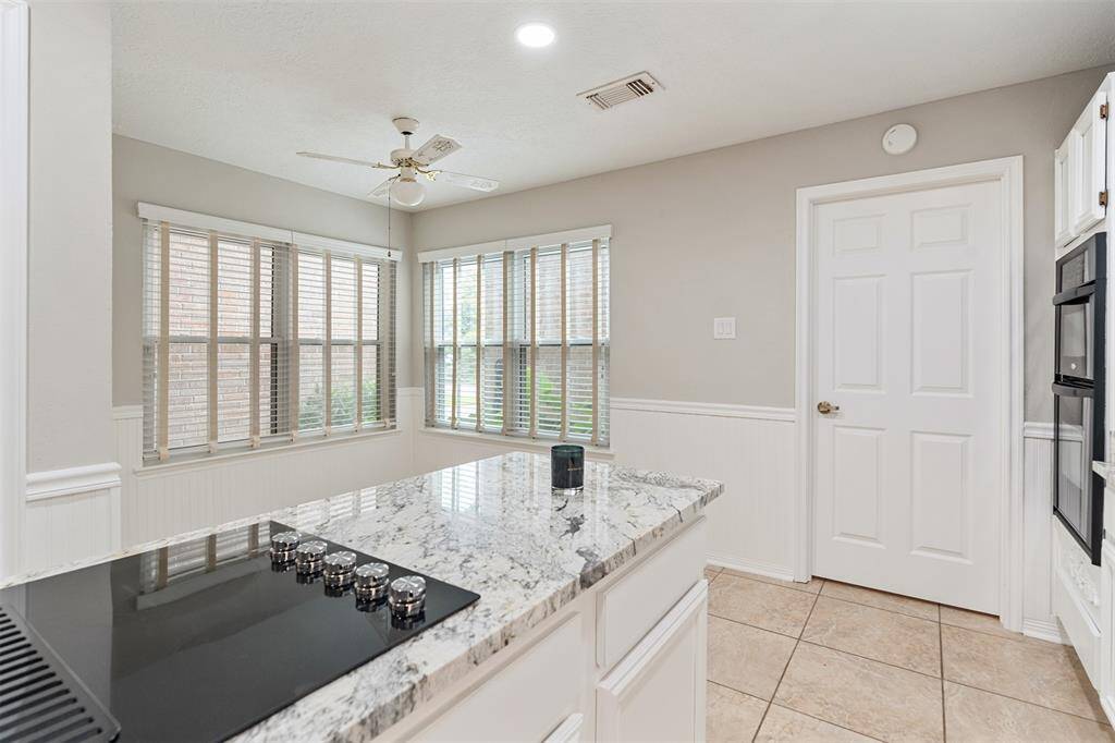 A large dining area is adjacent to the kitchen.