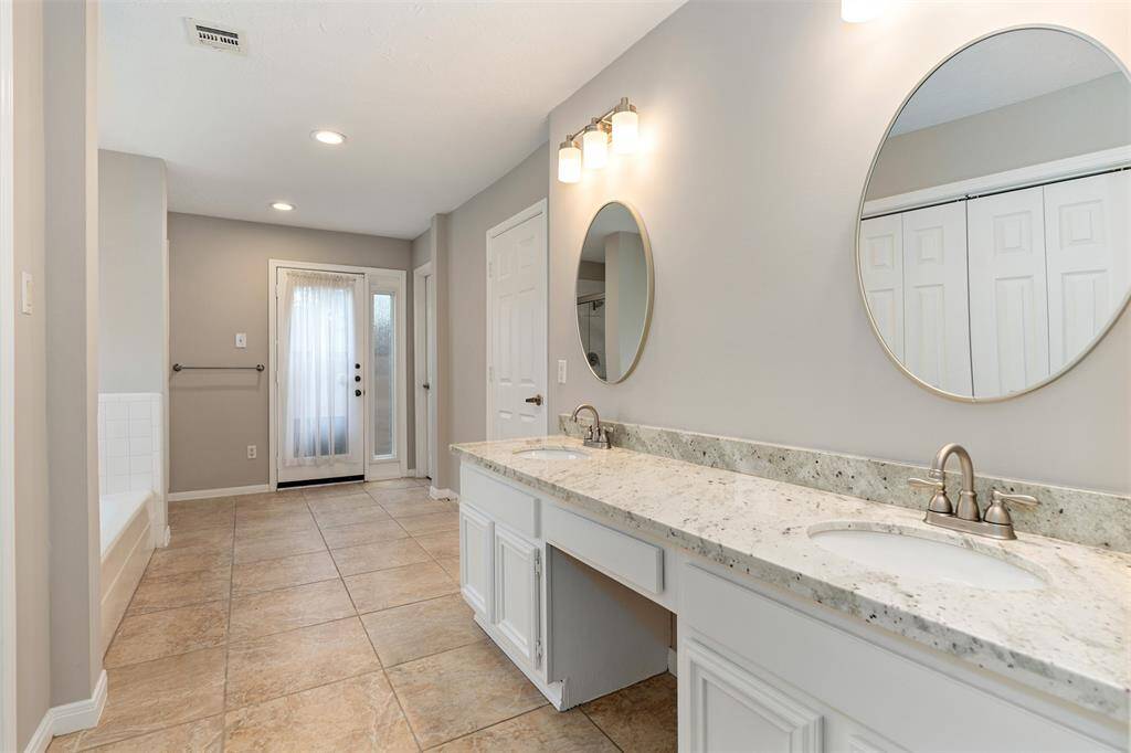 The ensuite bath has recent granite countertops, dual sinks and 2 closets.
