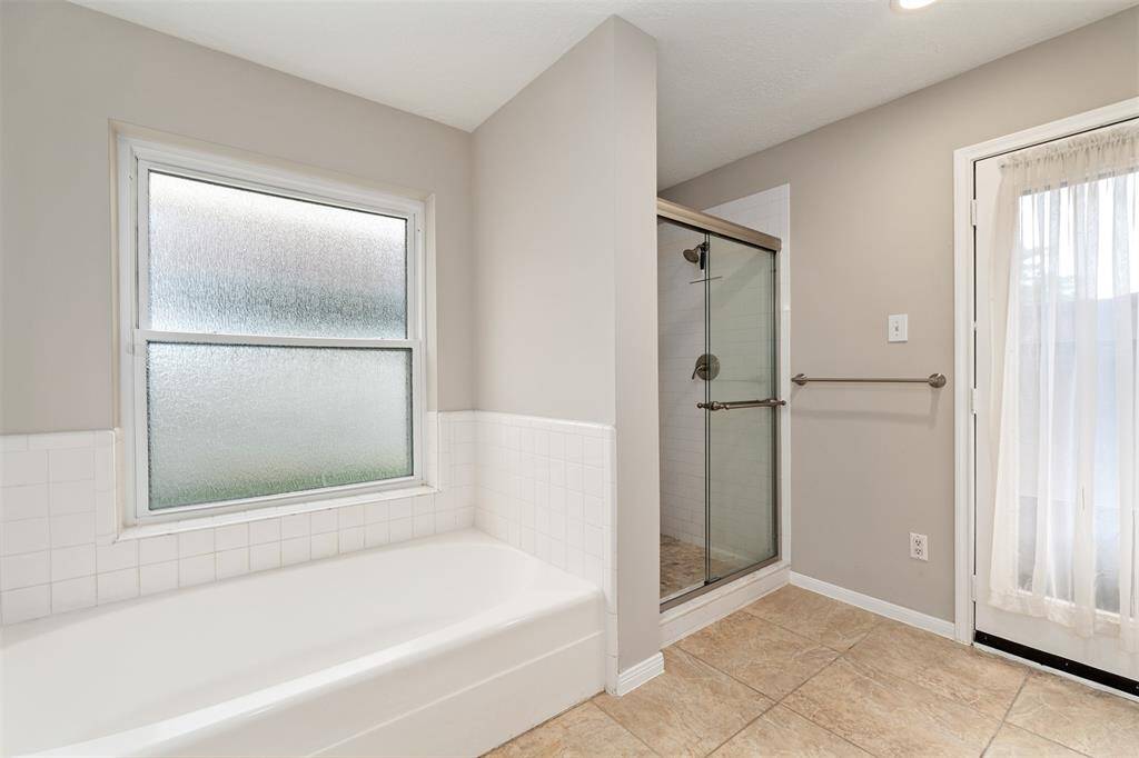 Notice the soaking tub and separate shower.