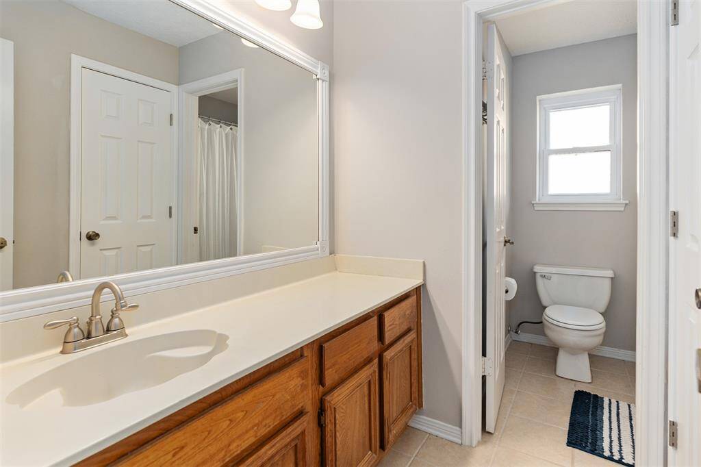 The second full bath serves the three bedrooms upstairs.