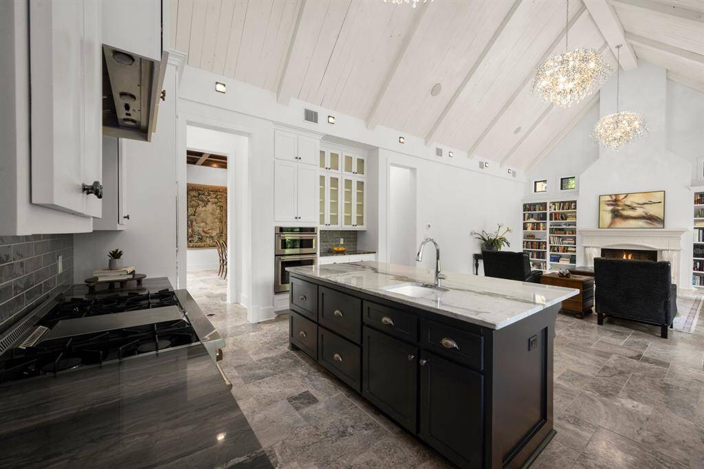 Professionally outfitted kitchen with ovens. professional grade 6 burner range/double