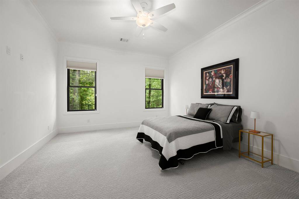 Spacious downstairs bedroom with sizeable walk-in closet.