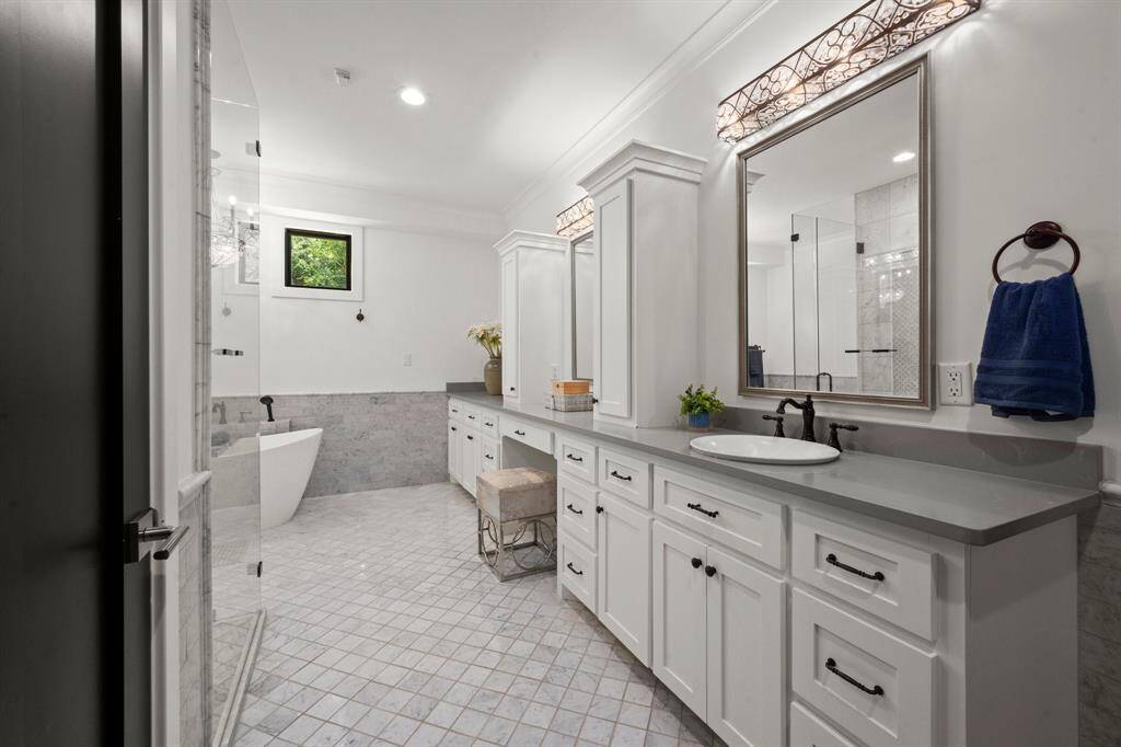 This is a beautifully designed bathroom that combines elegance with functionality.
