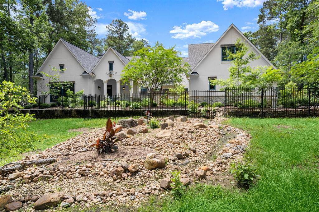The rock garden also doubles as drainage for the front fenced garden of the home.