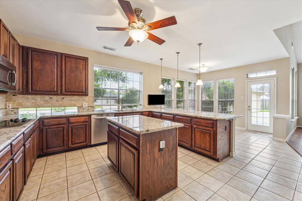 Kitchen with island looking to the breakfast room area.