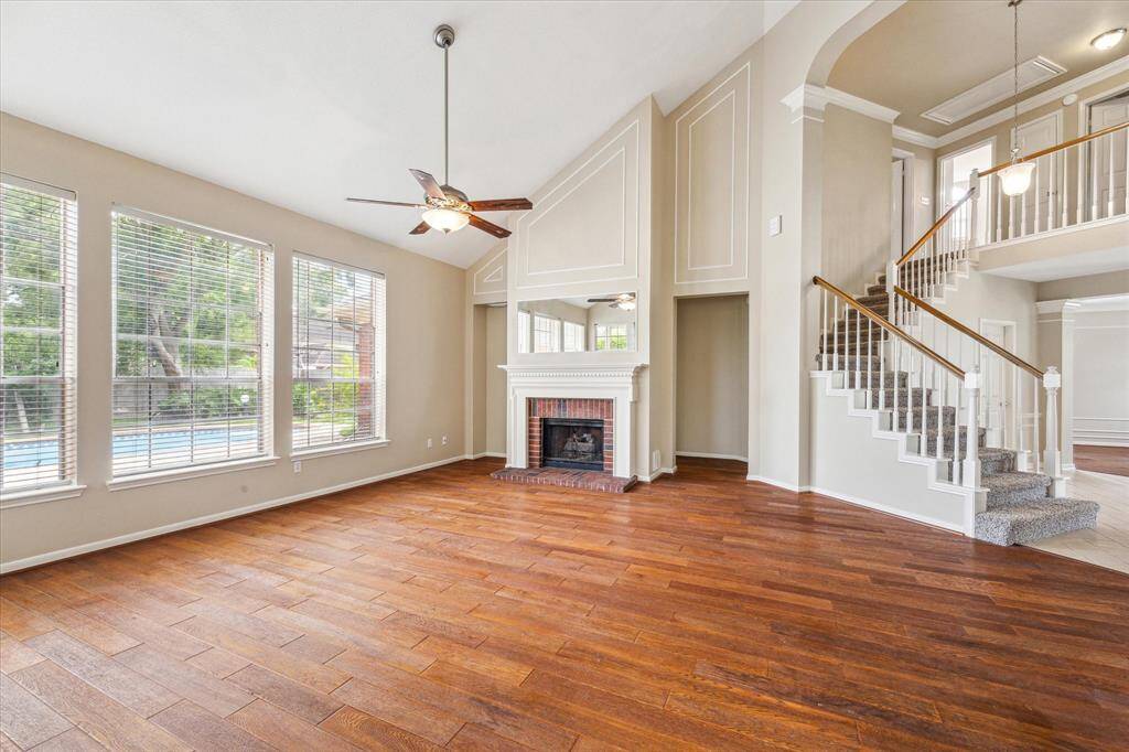The family room has windows that overlook the pool/spa.