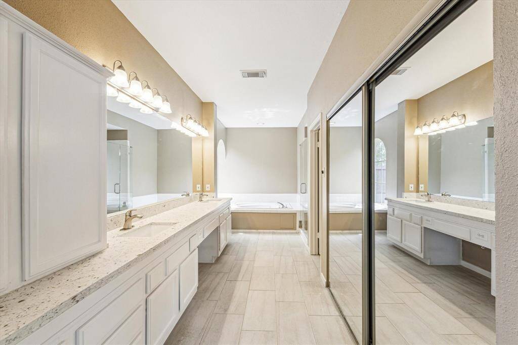 Primary bathroom has been updated and is light and bright.