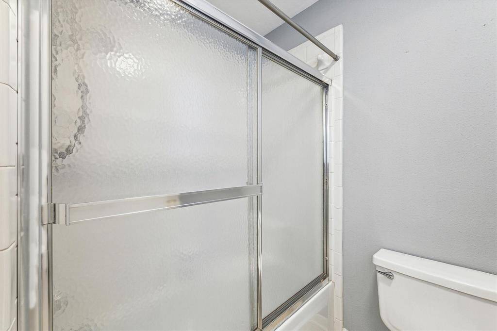 Upstairs bathroom has a tub/shower combo.