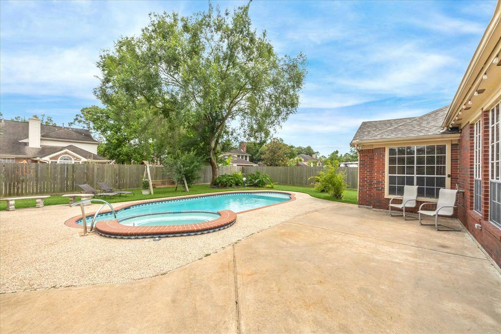 Huge backyard with pool/spa and room for a table for outdoor dining or a conversation set.