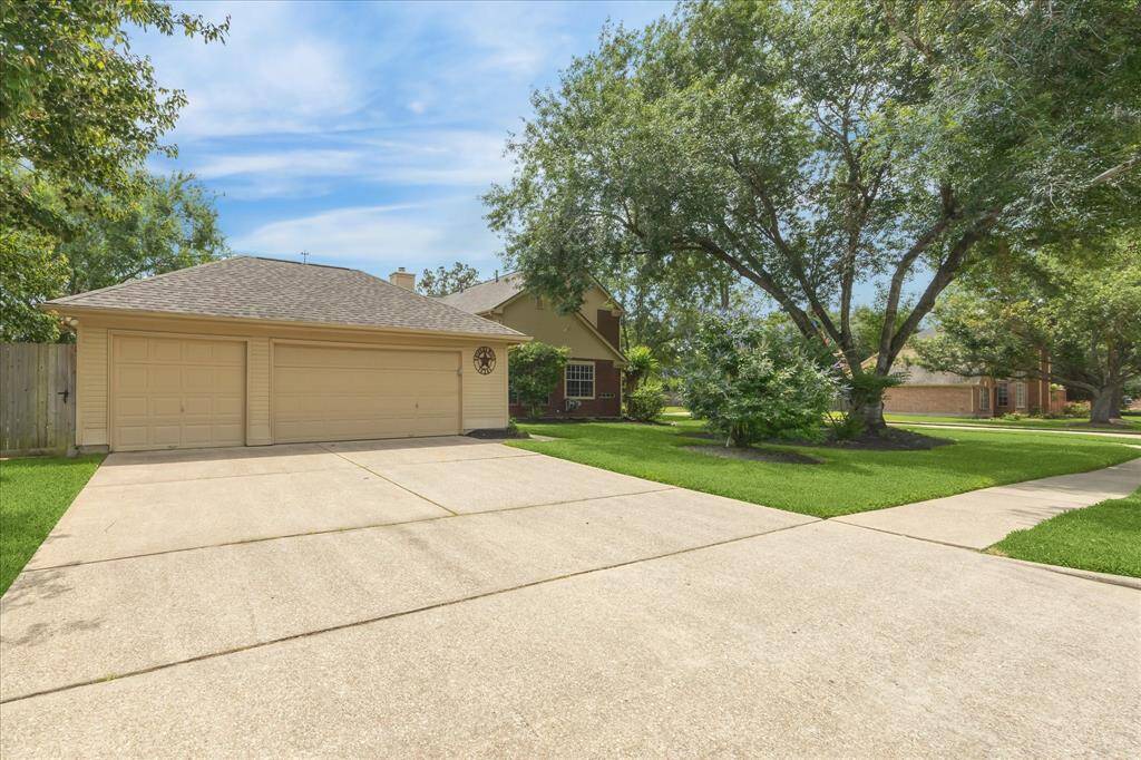 3 car detached garage with lots of driveway space for parking.