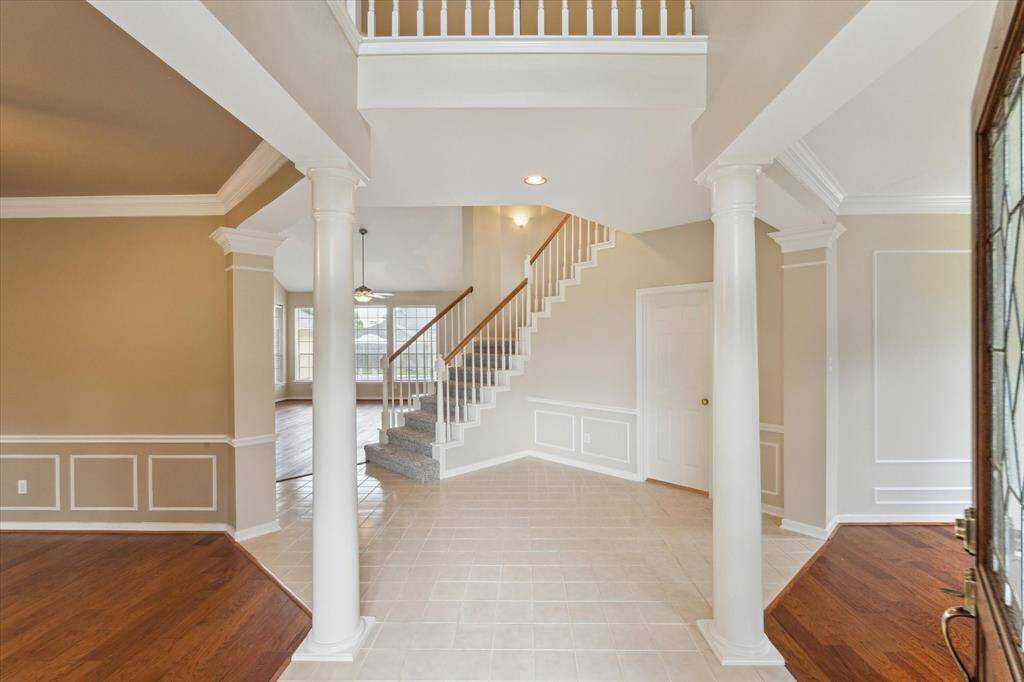 Upon entering the home, you have the dining room on your left and the formal living room/study space on your right.