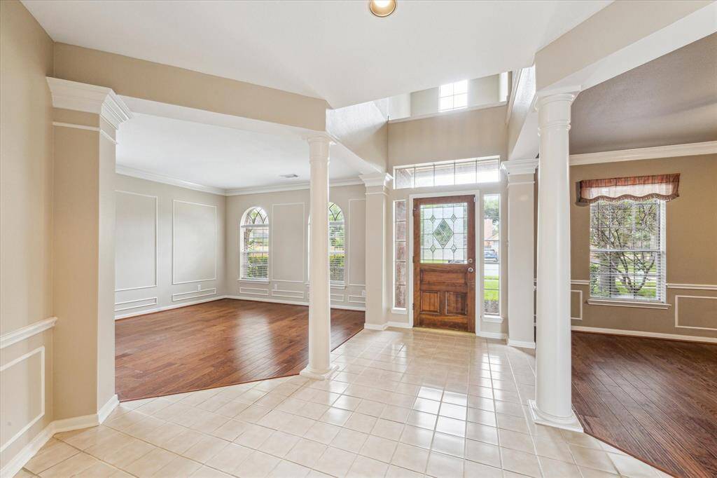 View of the front door into the formal living and dining rooms.
