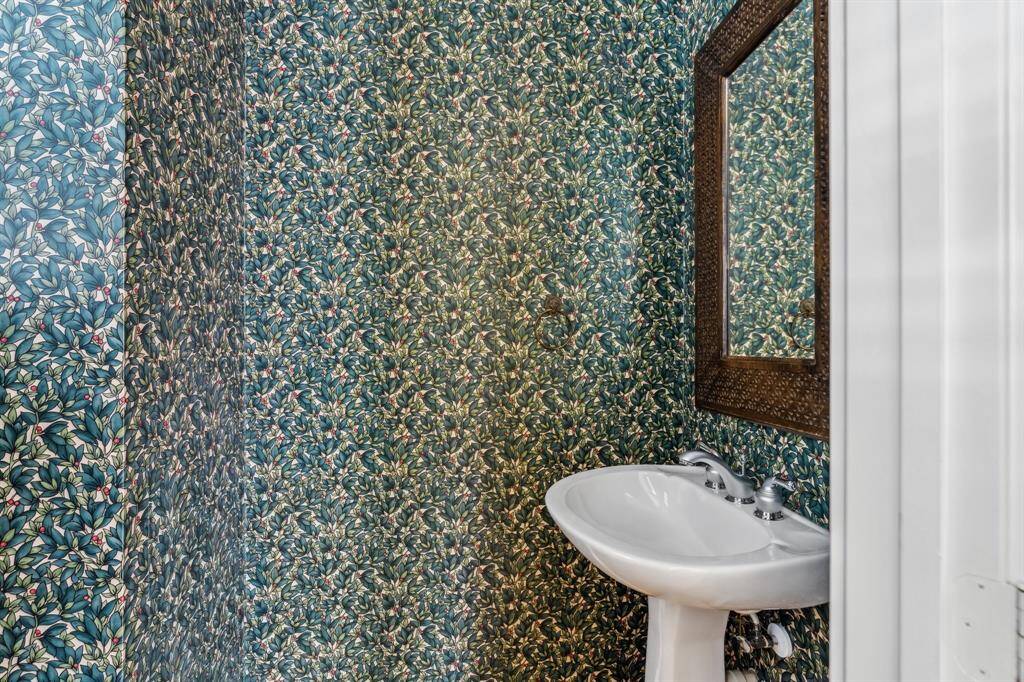 Powder bath on the second floor with modern fixtures and neutral finishes, ideal for guests.