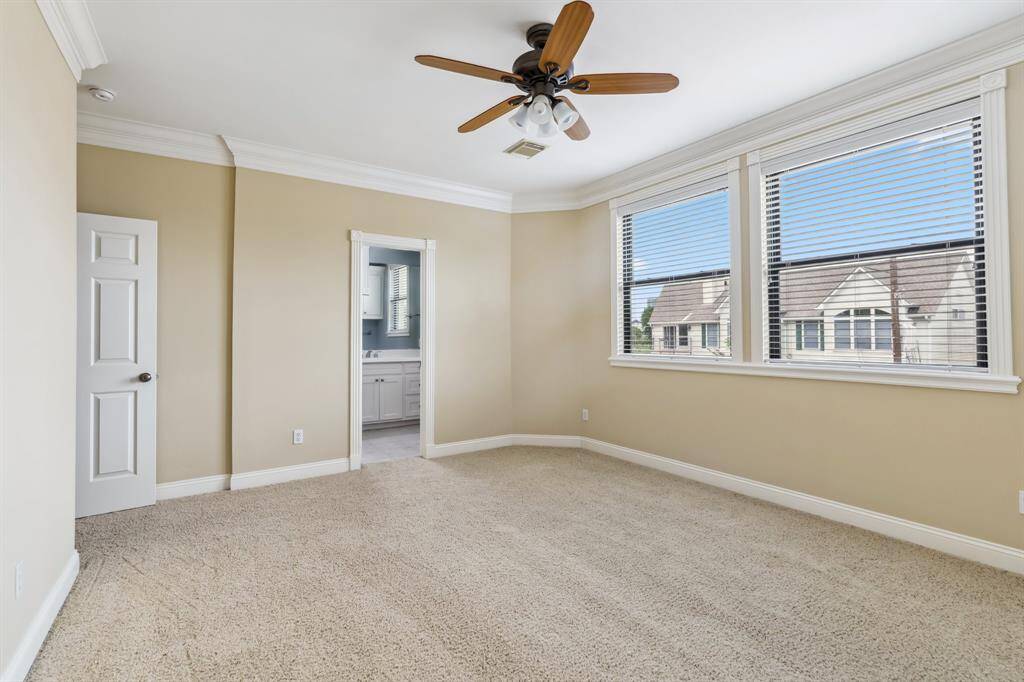 Another view of the third floor guest bedroom with generous light and closet space.
