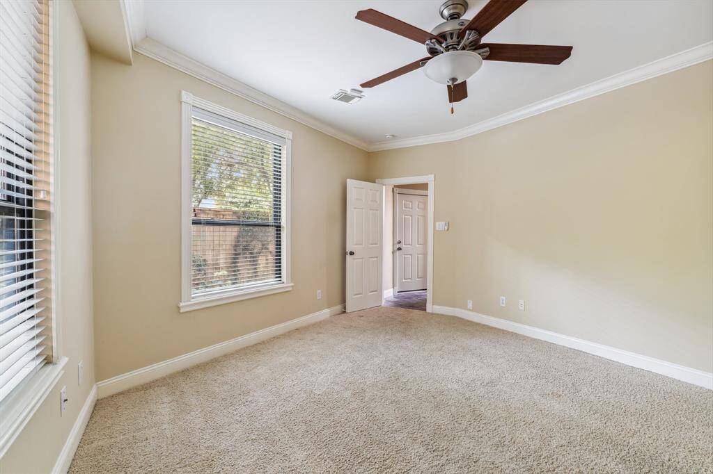 Another angle of first floor bedroom, great for guest space or home office setup.