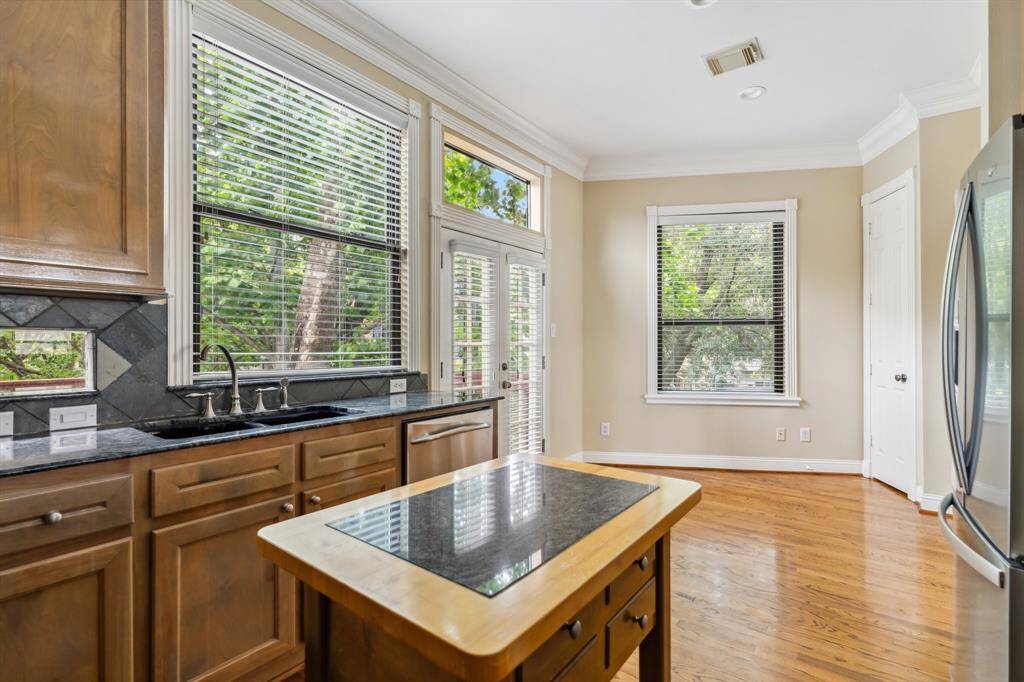 Another view of kitchen workspace and storage, ideal for meal prep and entertaining.