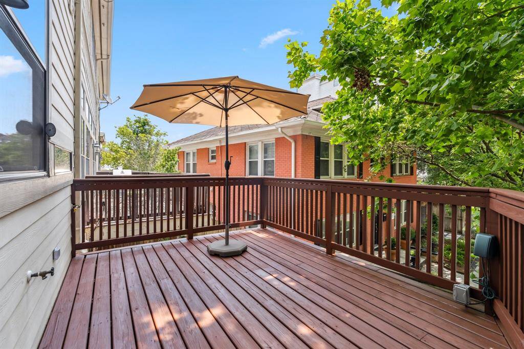 Private balcony off the kitchen, perfect for grilling, dining al fresco, or enjoying a breeze.