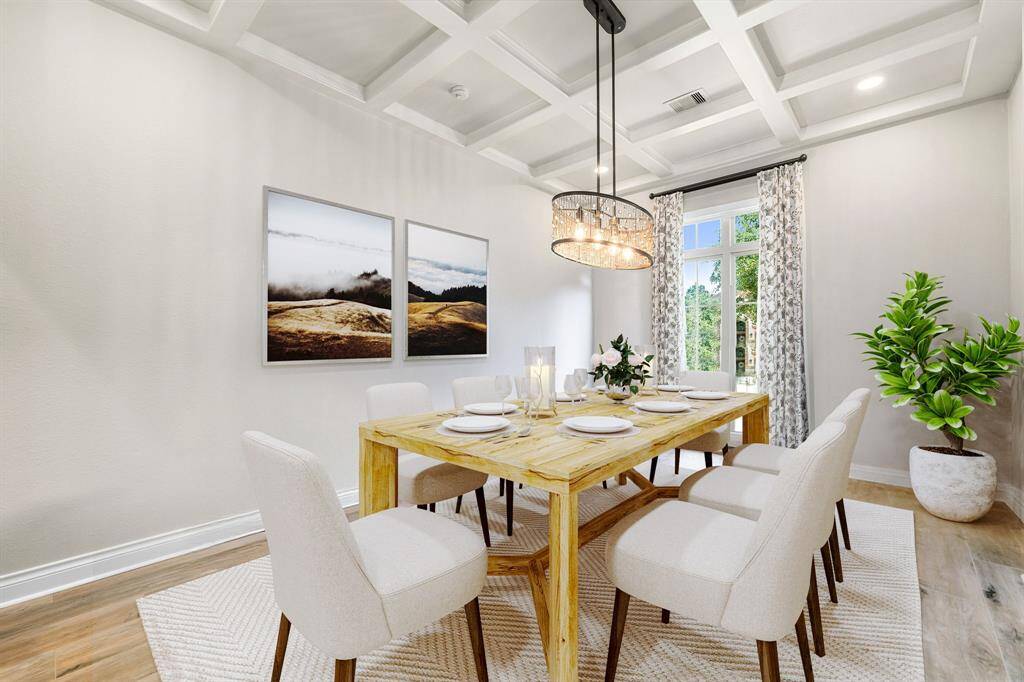 You and your guests will certainly dine in style in this amazing formal dining room! Featuring a gorgeous modern chandelier, large window with blinds, neutral paint, high trey ceilings and vinyl flooring. Perfect space to entertain family and friends.