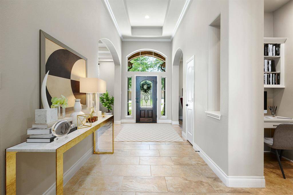 This beautiful kitchen equipped with a breakfast bar, recessed lighting, dark cabinetry, granite countertops and perfect for still hanging with all your guests with great access to your living room.