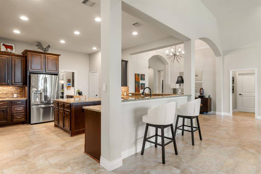 Any chef's dream, this stunning kitchen is perfect for everyday life as well as entertaining family and friends! Extra large kitchen counter is perfect for conversation or that much needed space to lay out your party spread for everyone to enjoy! Large windows provide lovely views of your backyard and plenty of natural lighting throughout the day.