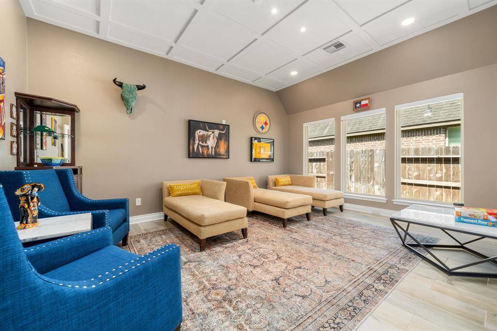 The alternate view of this room showcases the location right off the living room and kitchen with so many possibilities for this room! Game room, media, formal living, the options are endless!
