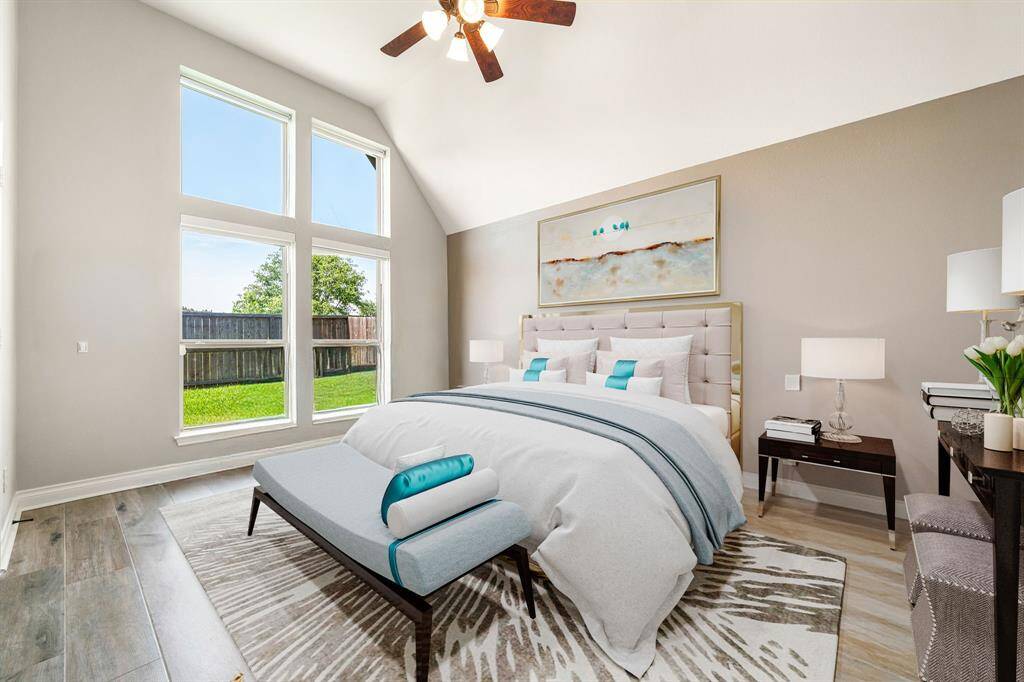 Secondary bathroom features granite countertops and dark cabinets, neutral paint, shower/tub combo with tile surround, large mirror, tile floors, sleek fixtures and plenty of space to accommodate any visiting family or guests.