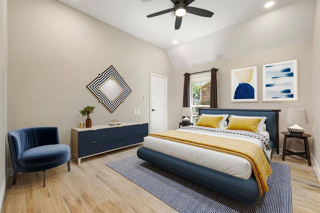 A built-in office nook adds functionality, while arched doorways lead seamlessly into the heart of the home.