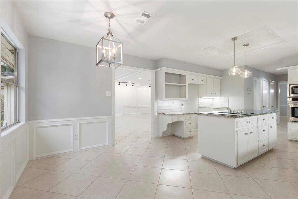 The breakfast room is bright, cheerful and where endless hours with family will be spent here.