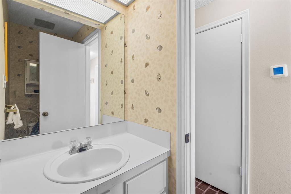 Half Bath located in the hall on Level 2
