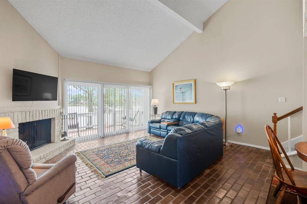 High ceilings and natural lighting fill the living area