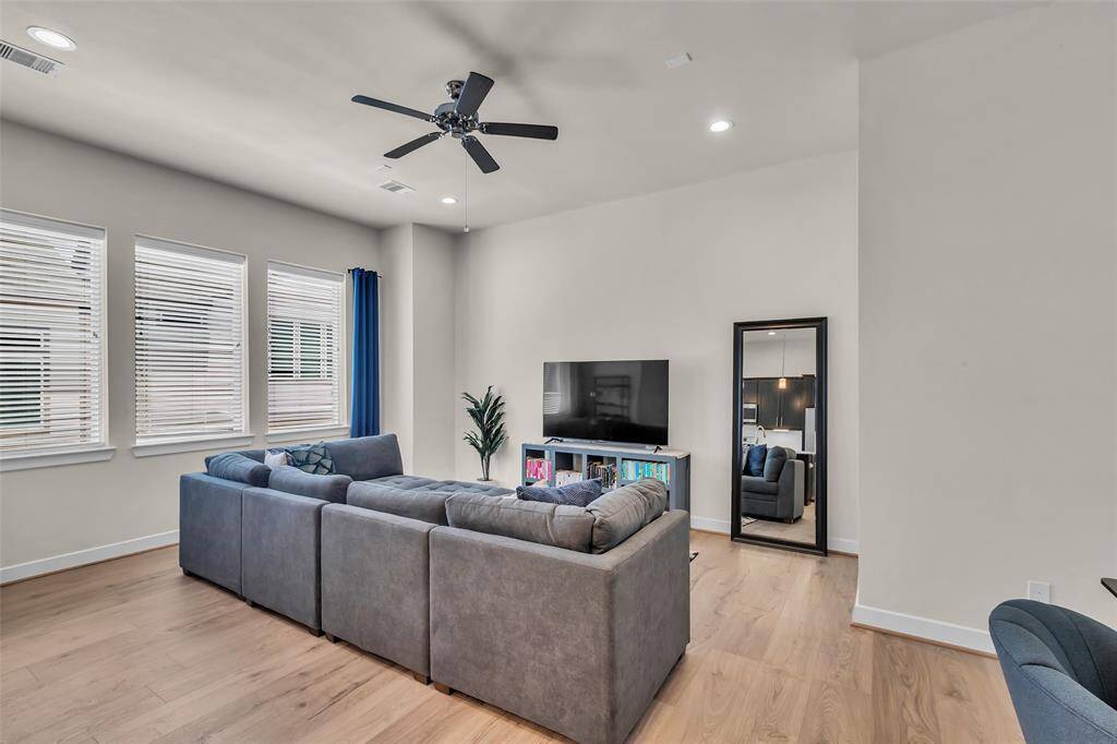 Generously sized living room on second floor with ample natural light.