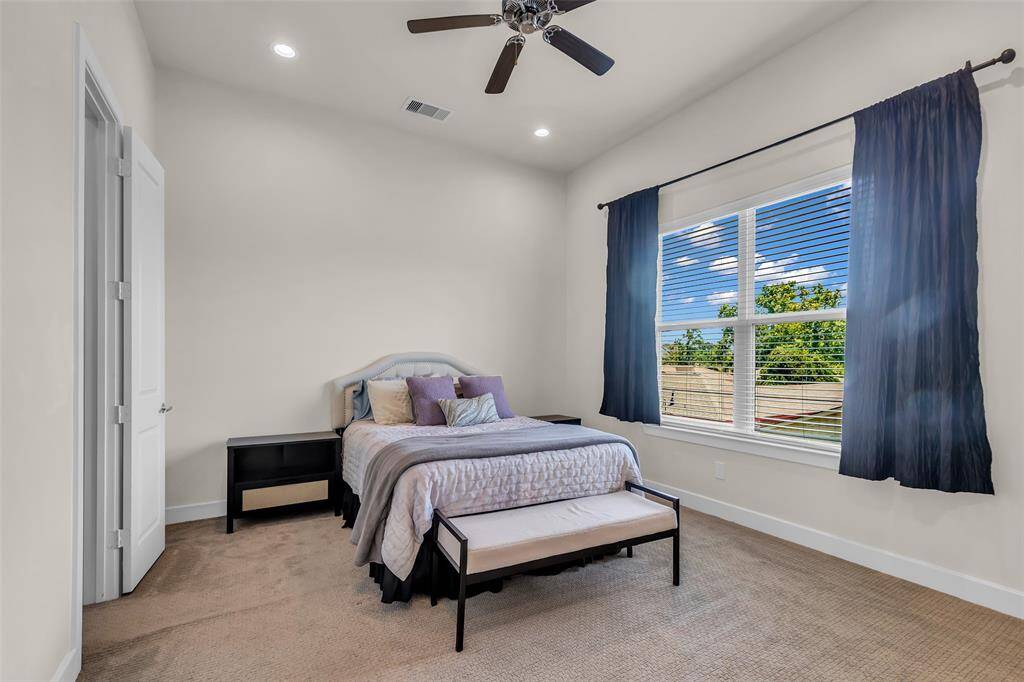 High ceilings and natural light in the primary suite.