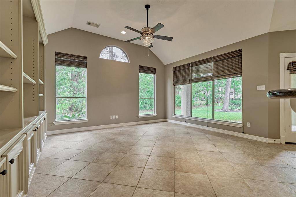 Custom woven wood shades adorn the windows in the main living areas.
