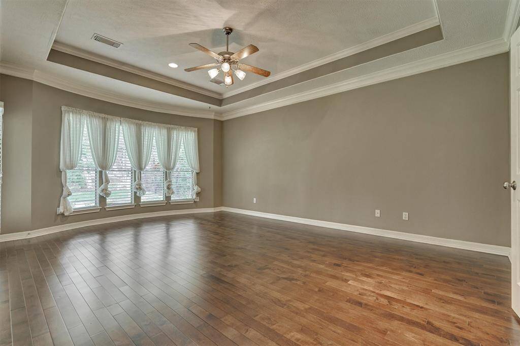 Trey ceiling and wall of windows in the peaceful and private owner's retreat.