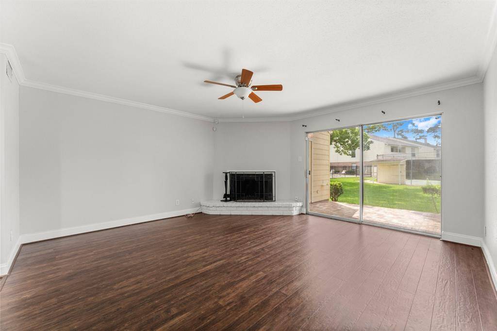 Family room with wood burning brick fireplace
