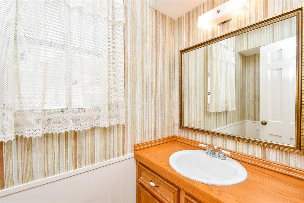 There is a half bath between the family room and kitchen.