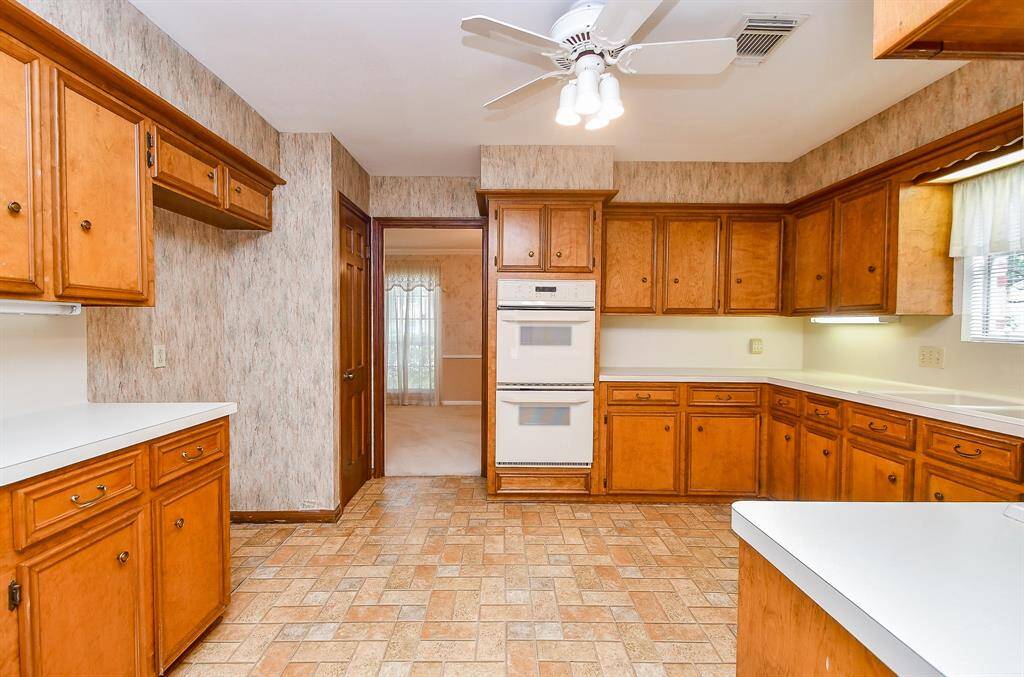 The kitchen flows into the dining room.