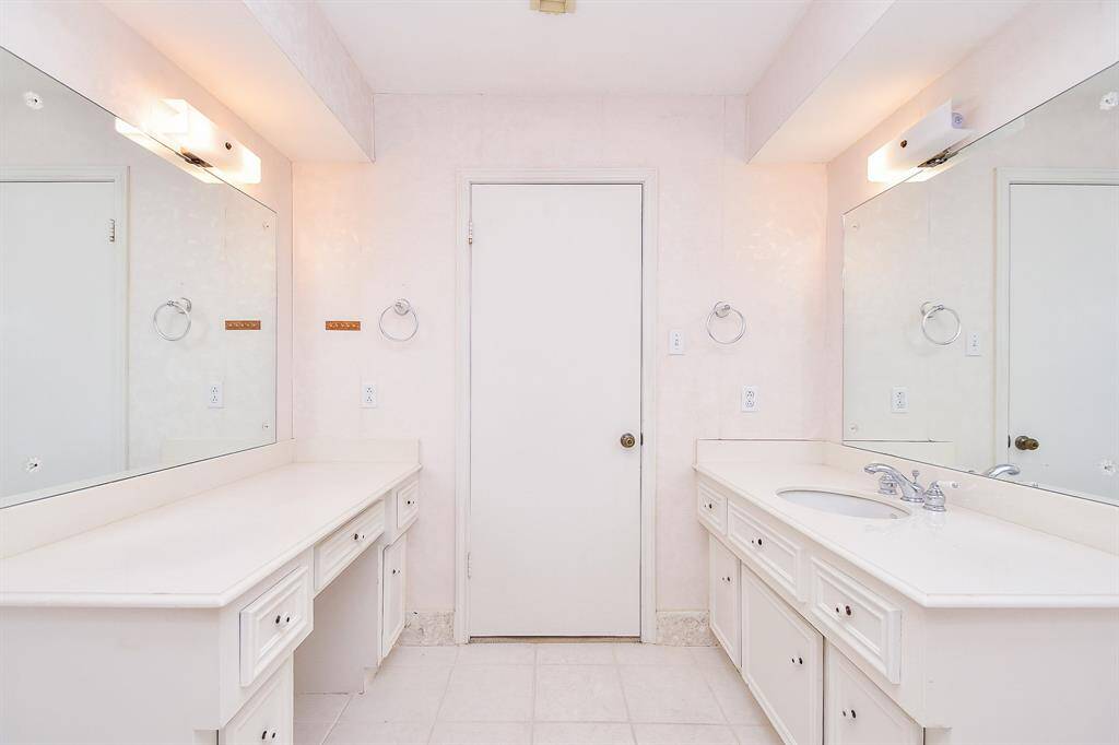 The hall bath has two vanities and one sink.