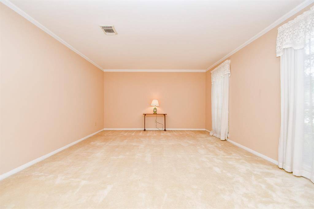 The living room overlooks the front yard. If renovating, this room could open to the family room.