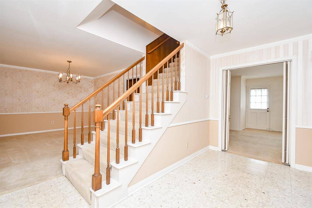 The dining room is to the left of the stairs and entry. This room could be an extension of the kitchen if preferred.